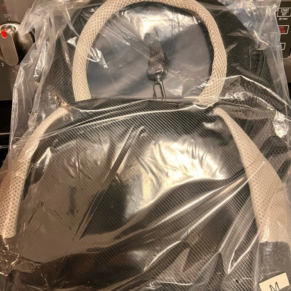 Portable new doggie backpack. Medium dog size. Oxford style. Pockets.Harness